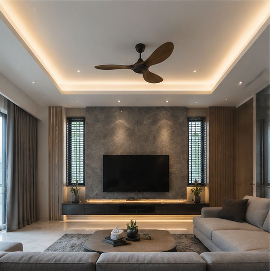 Tray ceiling with cove lighting above a marble feature wall, residential living room